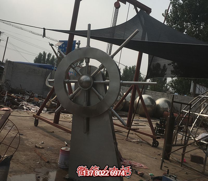 騰飛不銹鋼雕塑船舵，點綴室內(nèi)飯店